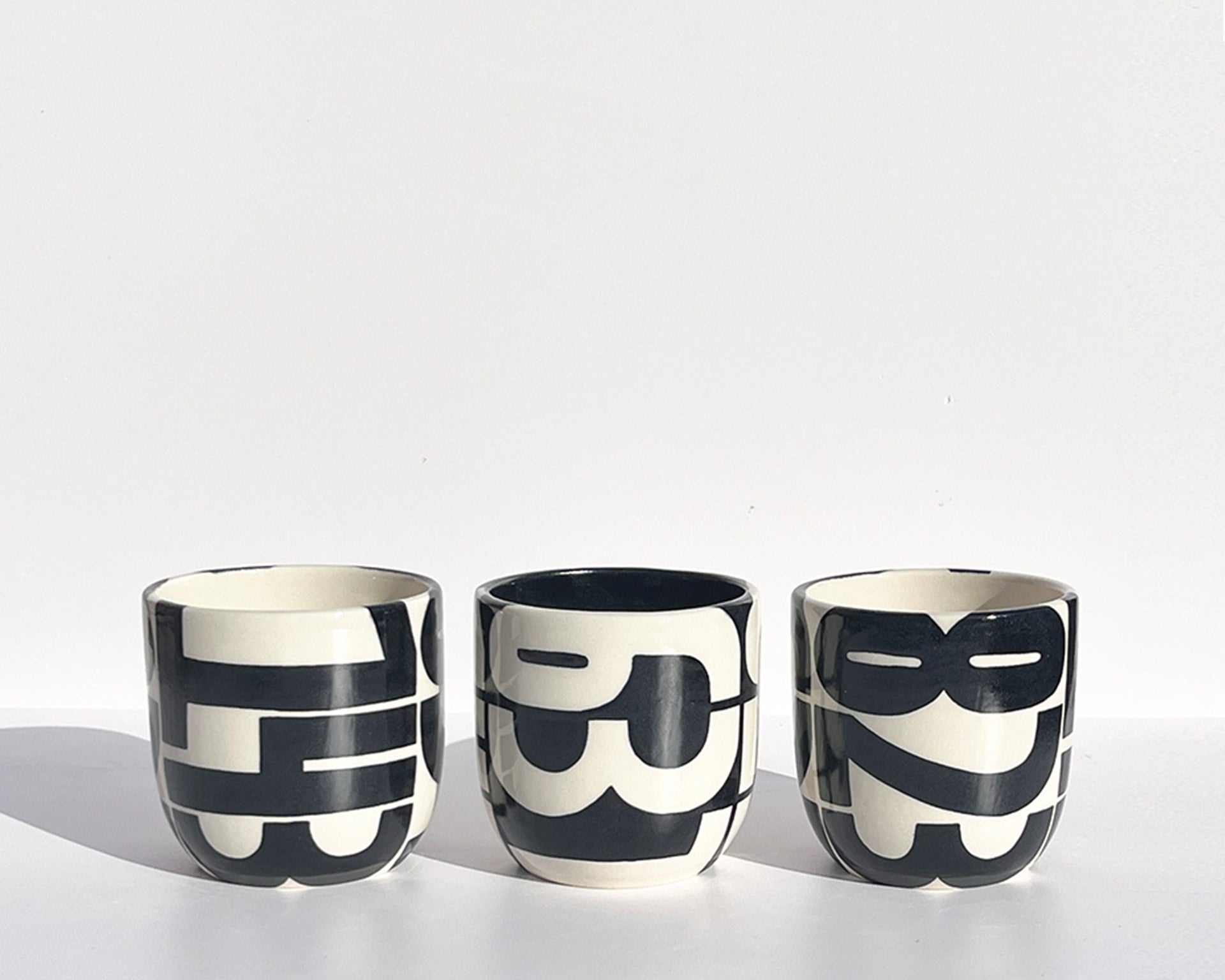Hand-painted pager codes mugs: "143", "637", and "823"