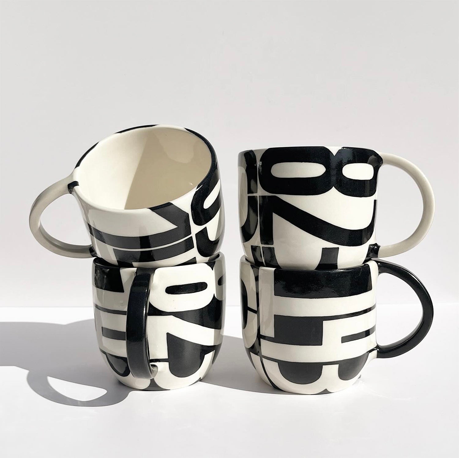 Hand-painted pager codes mugs: "143", "637", and "823"