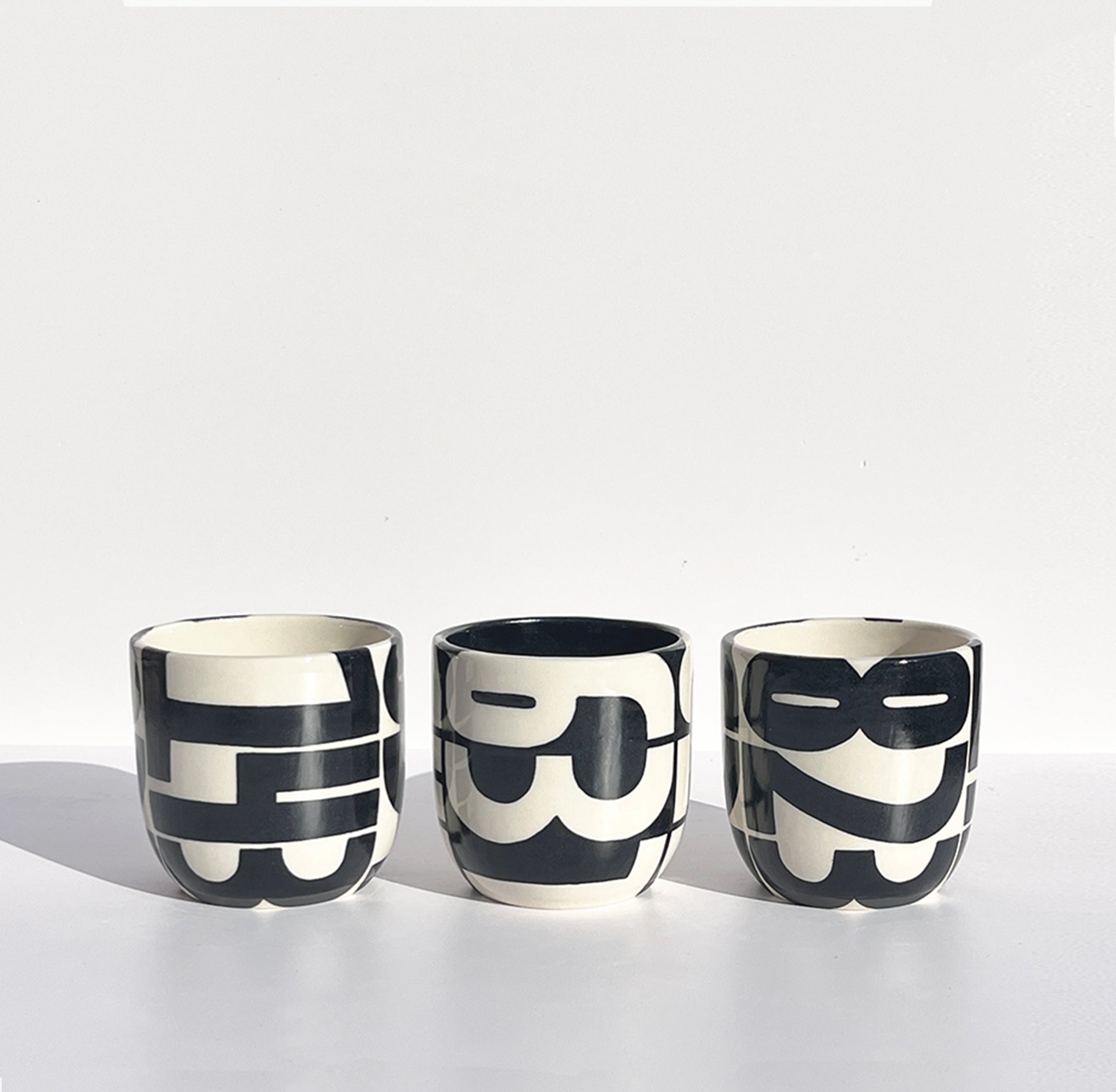 Hand-painted pager codes mugs: "143", "637", and "823"